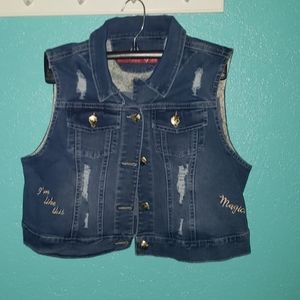 A sleeveless jean jacket